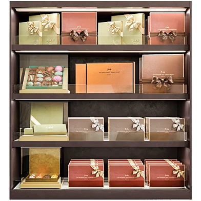 Showcase with boxes of candies. Sweets and chocolate