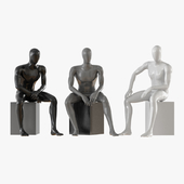 Three seated faceless mannequins 13