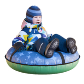 A child is riding on a snow tubing