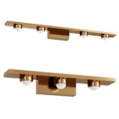 Series of wall lights in the form of a brass color strip with lensed LEDSeries